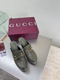 Gucci ladies platform mules in dark green, with gold horsebit buckle detail