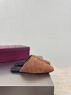 Single women's brown monogram loafer with gold chain bit and black slide sole
