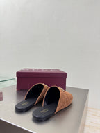Pair of women's brown monogram mules with gold chain bit; black insoles