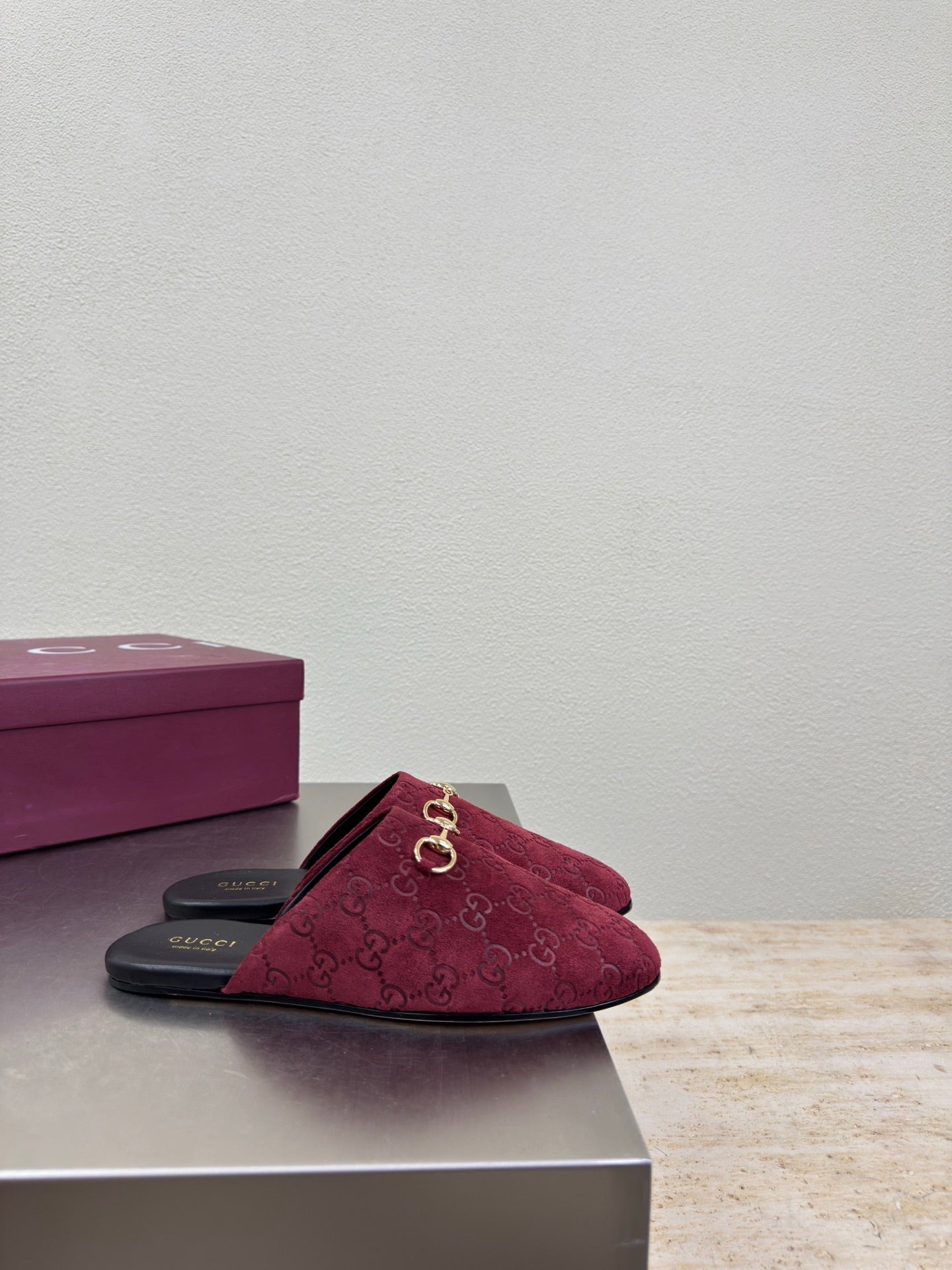 Gucci women's burgundy GG-pattern mule with gold horsebit and black footbed