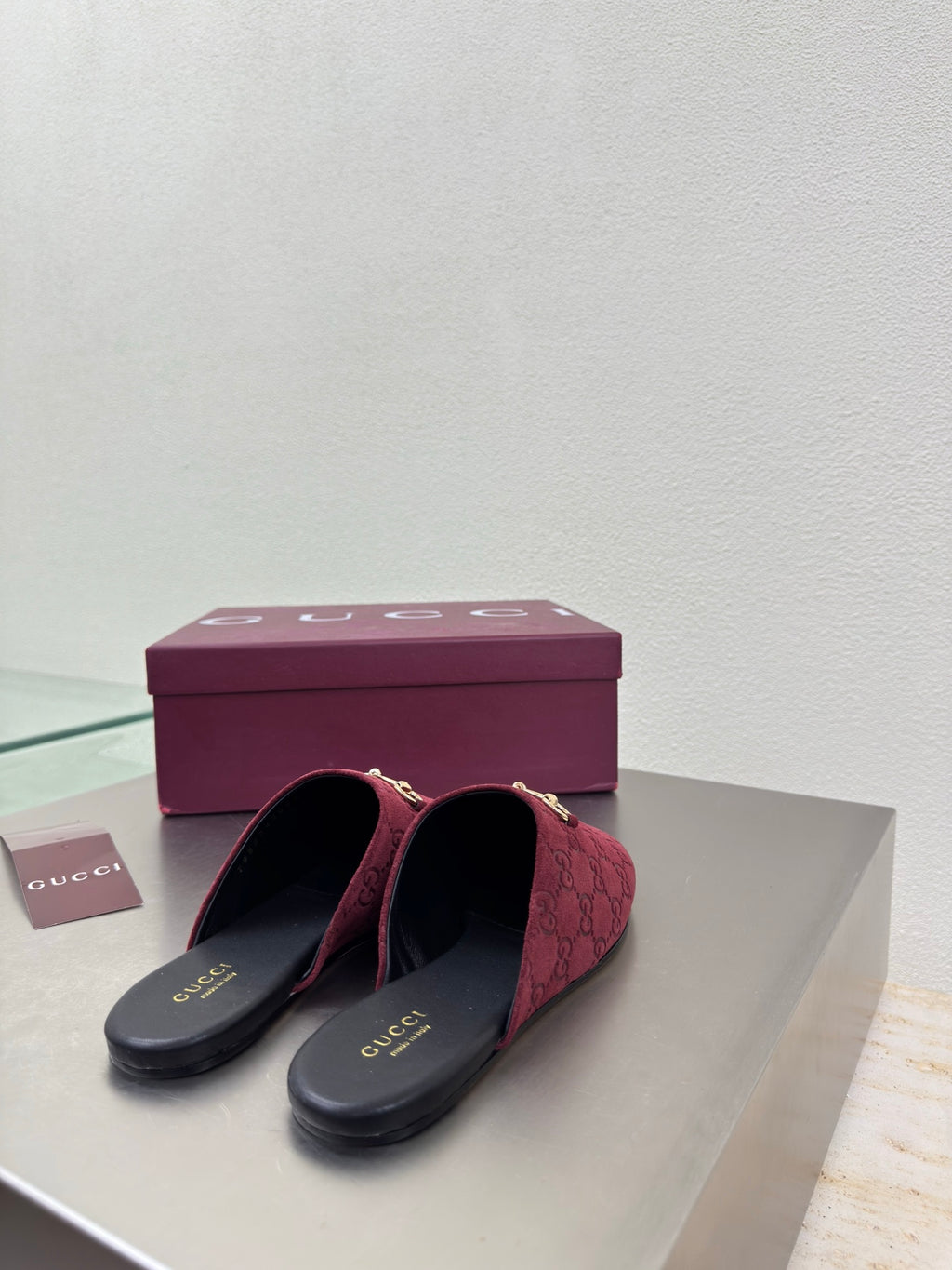 Gucci women's burgundy GG-pattern mule shoes with gold horsebit, pair on box