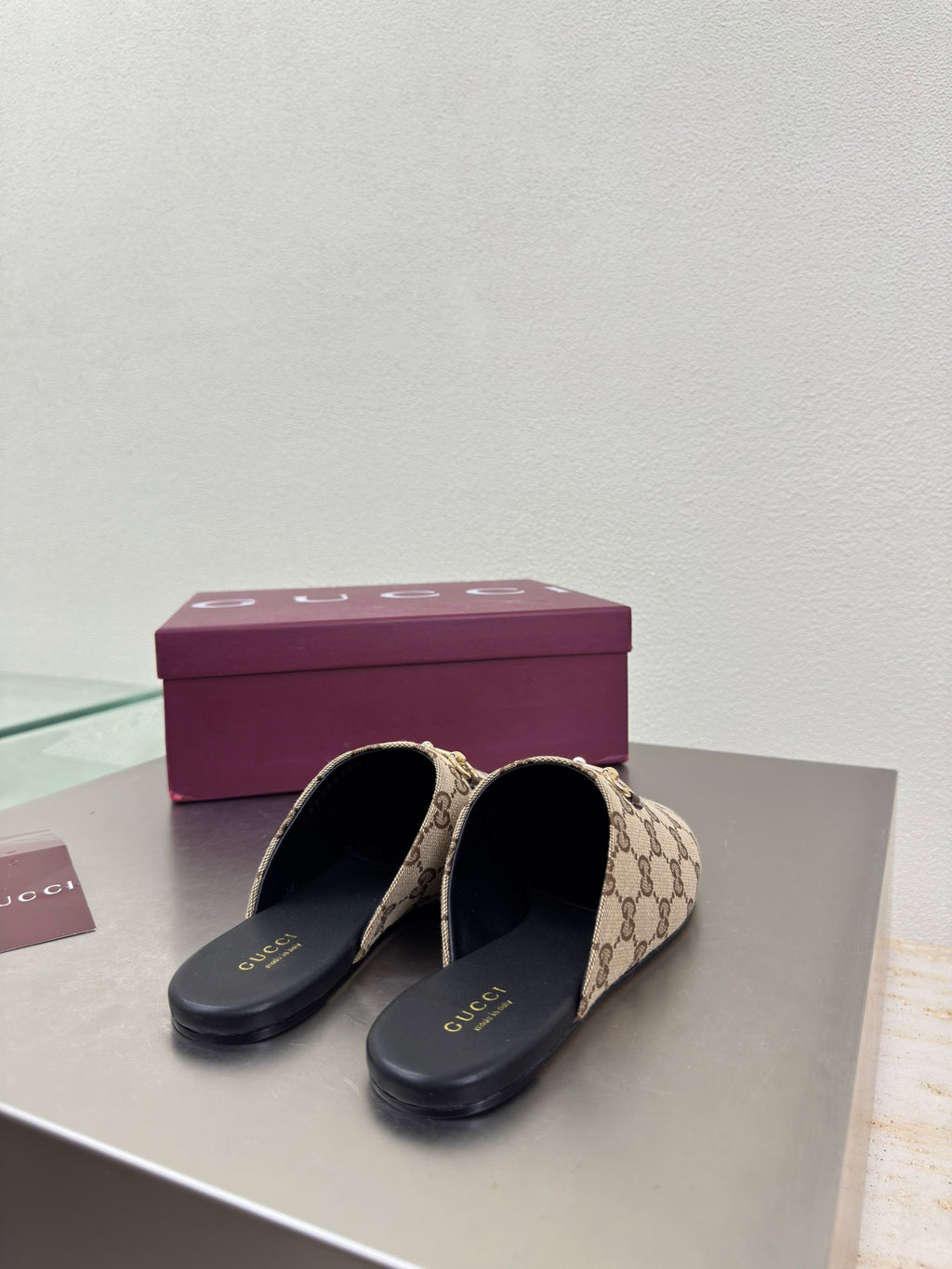 Gucci women’s GG-pattern slip-on loafers, pair with black insoles