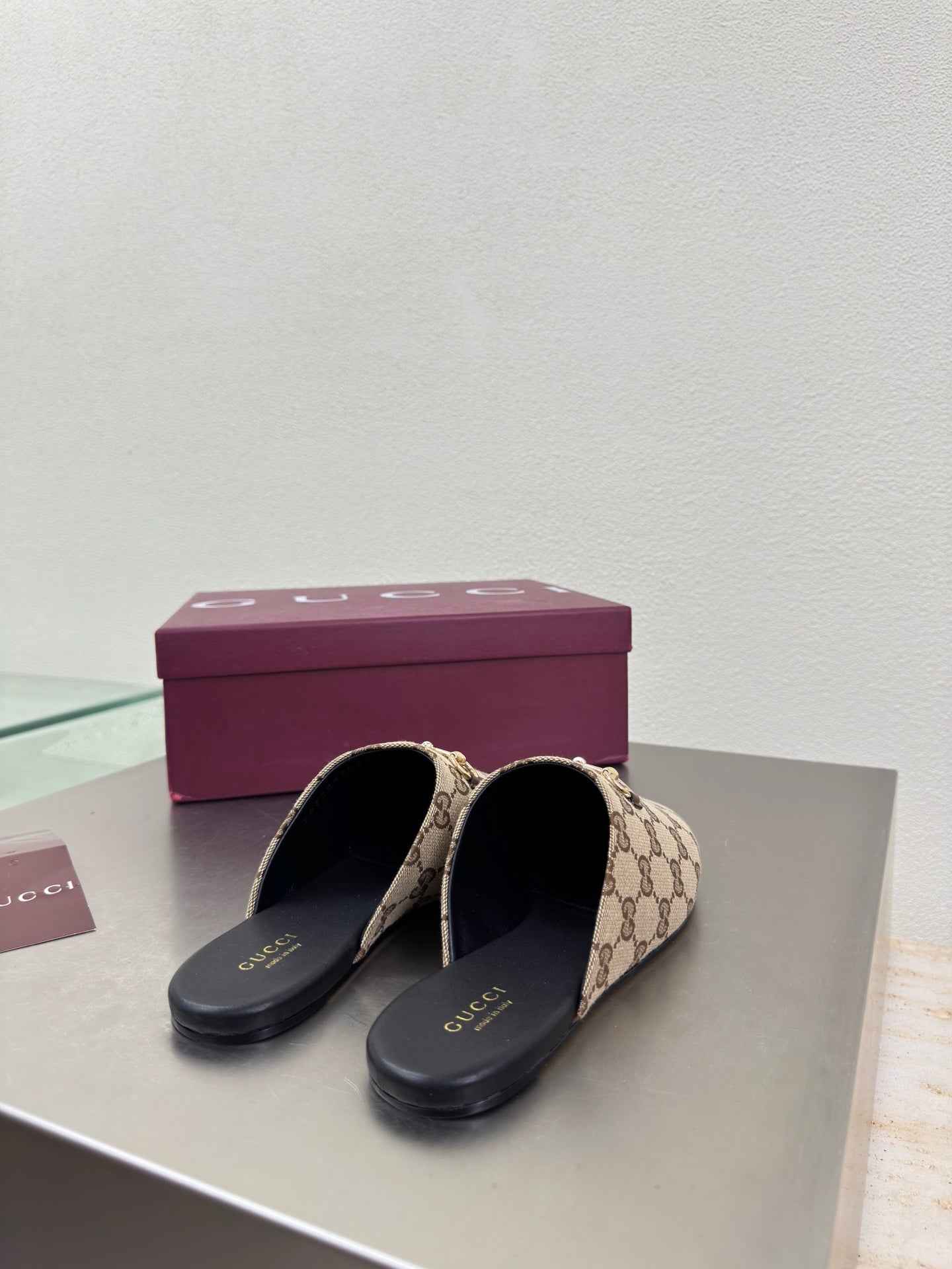 Gucci women’s GG-pattern slip-on loafers, pair with black insoles