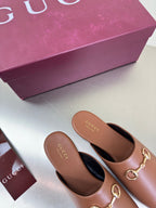 Gucci women's brown leather loafers, gold horsebit hardware on vamp