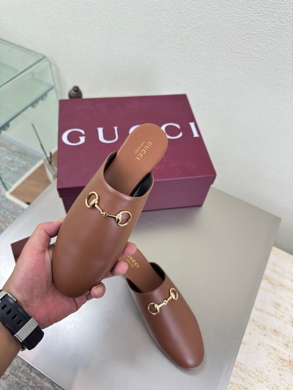 Gucci women's brown leather loafers with gold horsebit, side view