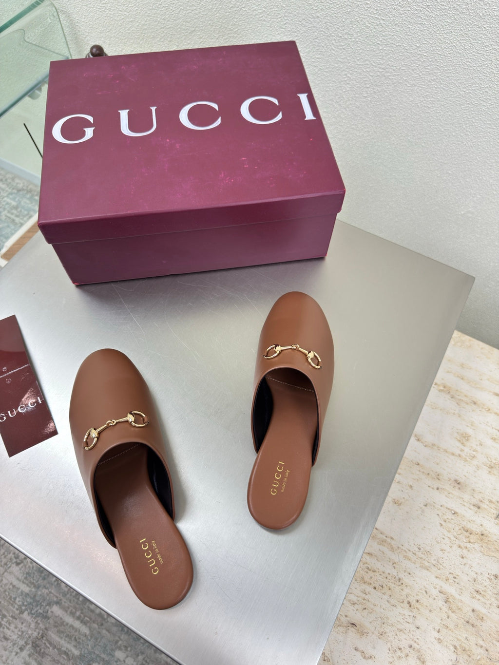 Gucci women's brown leather loafers with gold horsebit detail, pair view