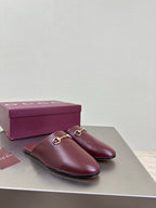 Burgundy leather mule shoe with gold horsebit on the side, open back design