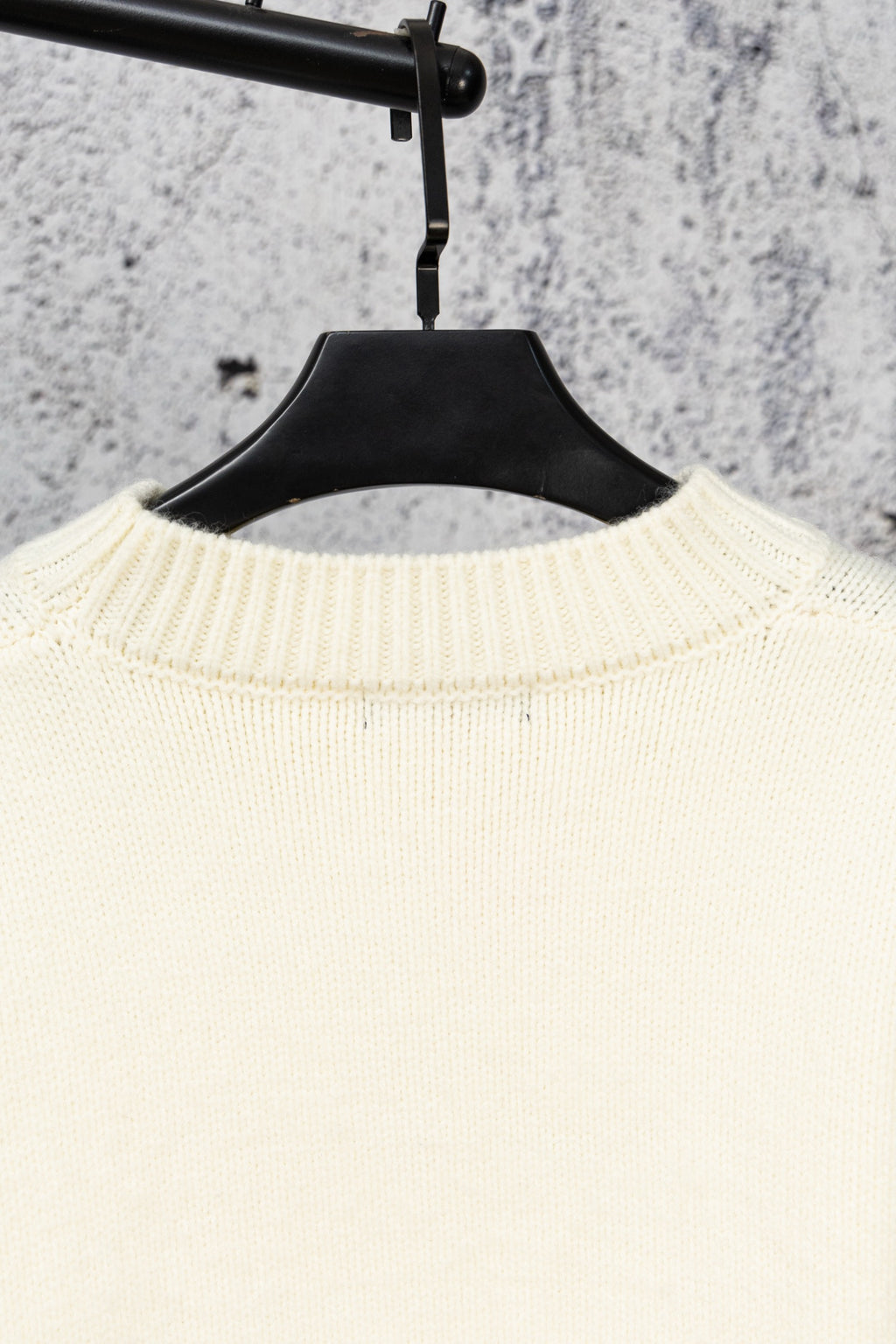 Ivory knit sweater collar with ribbed knit texture
