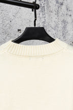 Ivory knit sweater collar with ribbed knit texture