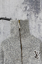Grey knit sweater with zip front and small Louis Vuitton-style right-chest emblem