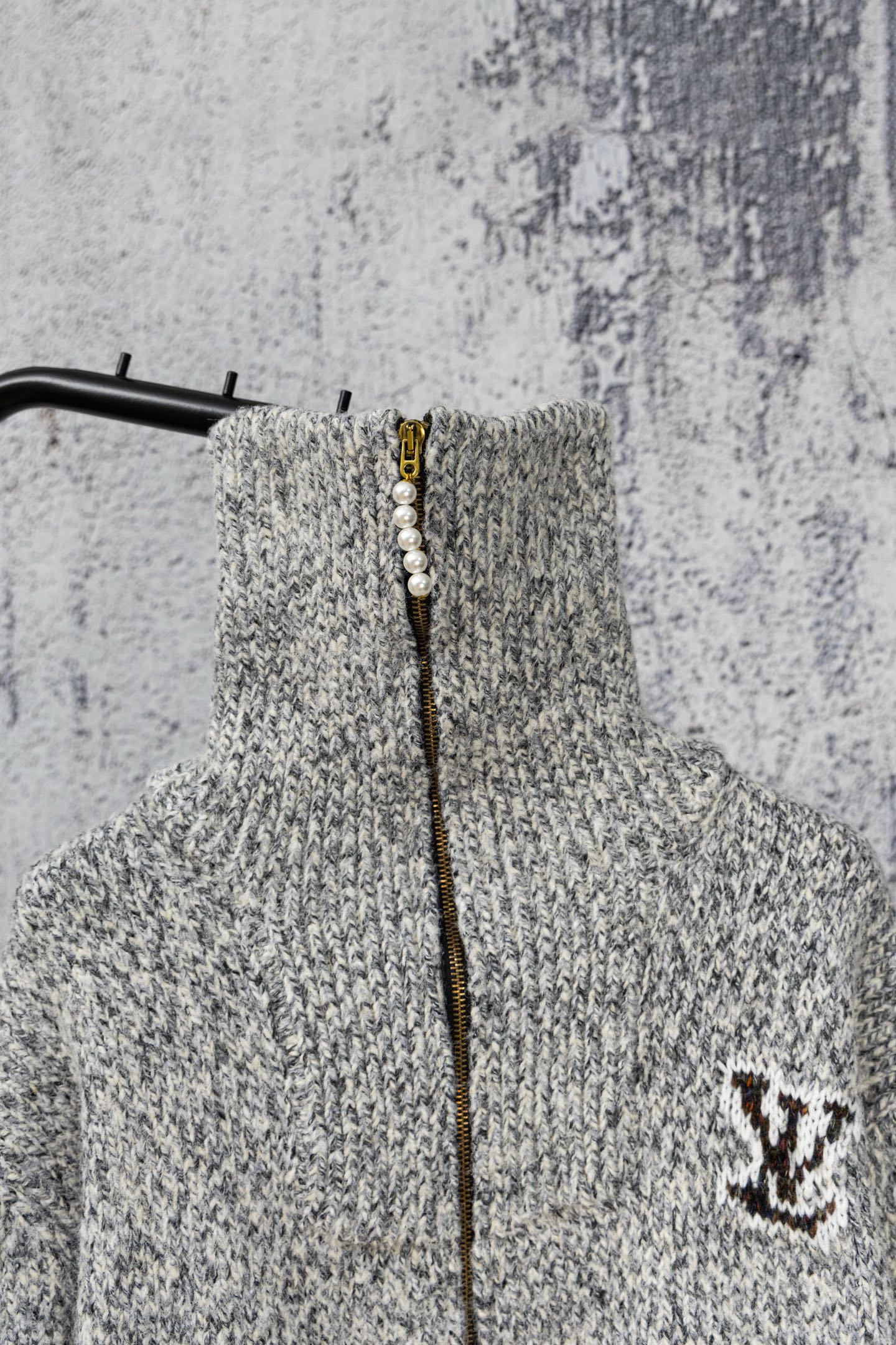 Grey knit sweater with zip front and small Louis Vuitton-style right-chest emblem