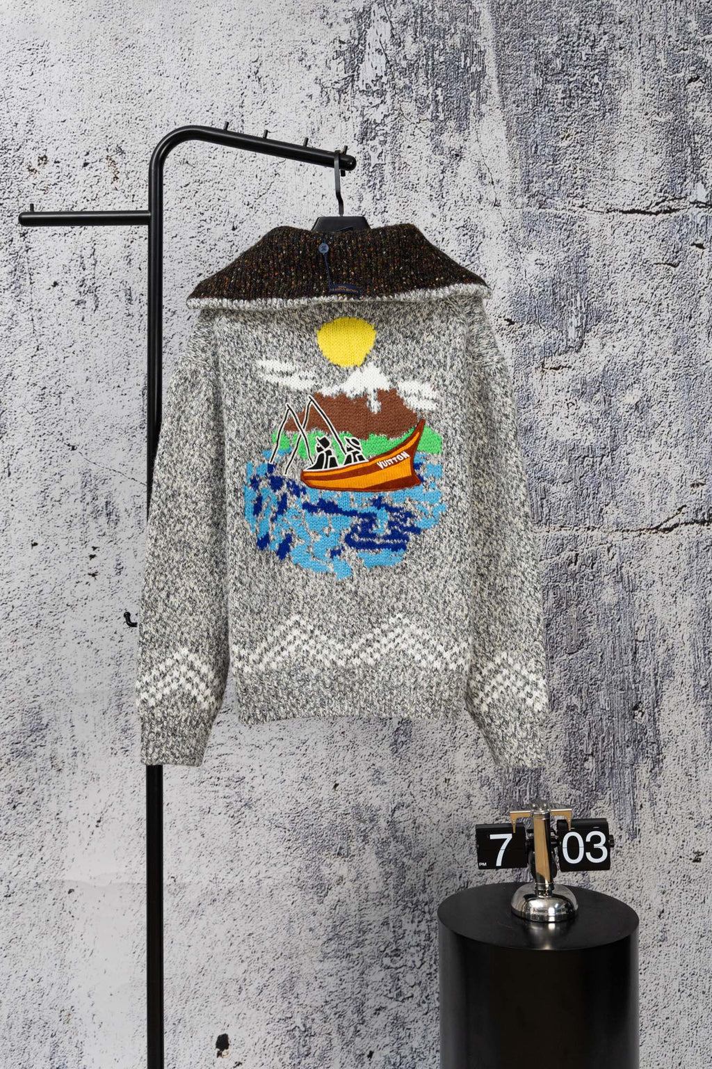 Grey long-sleeve knit sweater with zipper and colorful chest graphic