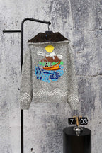 Grey long-sleeve knit sweater with zipper and colorful chest graphic