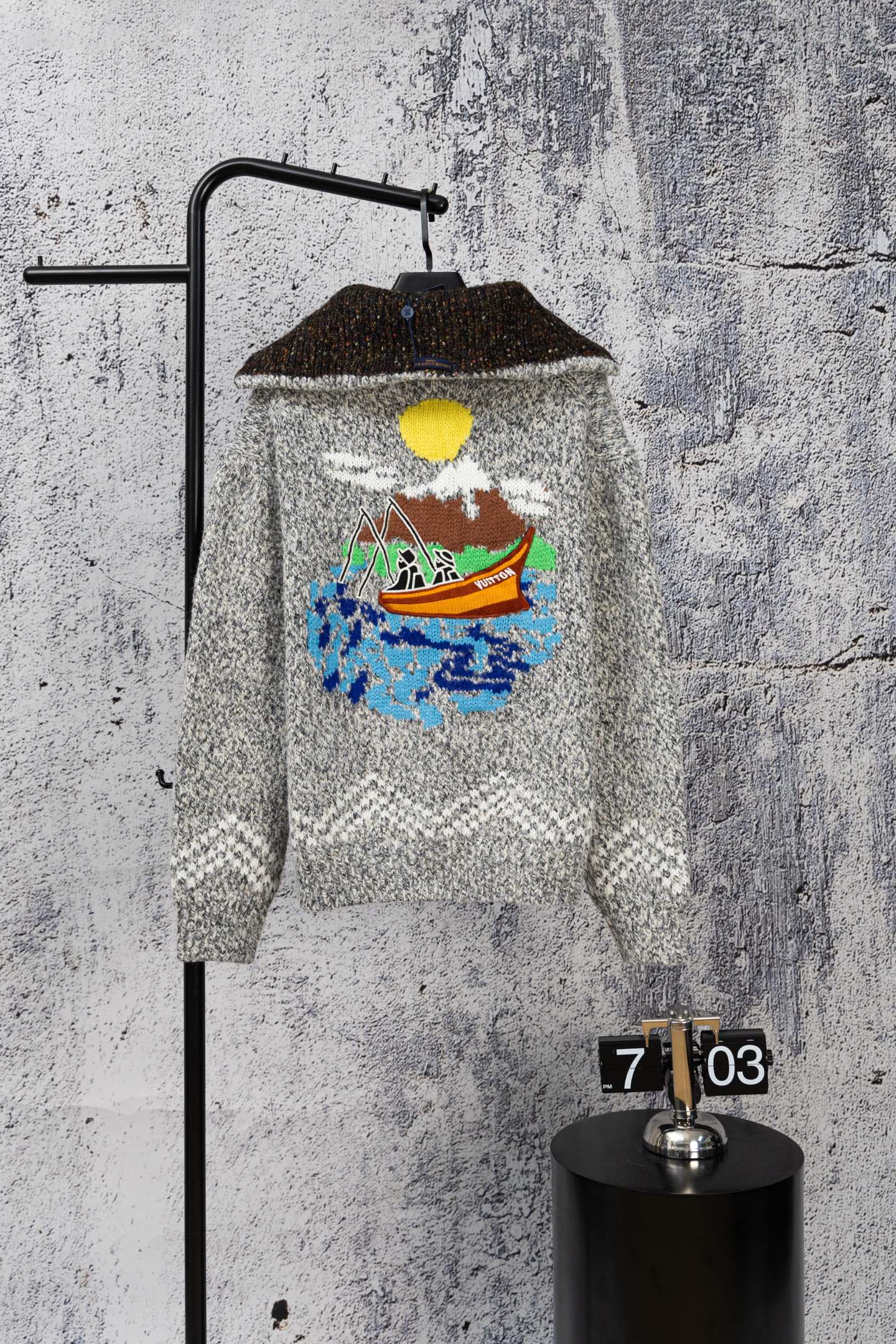 Grey long-sleeve knit sweater with zipper and colorful chest graphic
