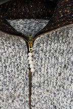 Long knit sweater with gold half-zip and faux pearl pull, textured gray
