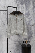 Grey long-sleeve knit sweater with zipper and small Louis Vuitton-style chest emblem