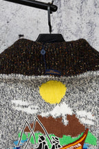 Grey knit sweater back with black ribbed collar band and colorful chest graphic