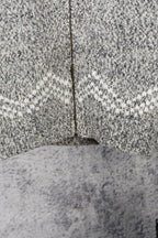 Grey knit sweater with centered zipper seam and ribbed hem