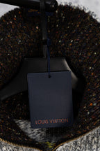 Knit sweater with Louis Vuitton shopping bag tag on display