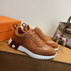 Brown suede lace-up sneakers with grid stitched panels and white midsole blocks