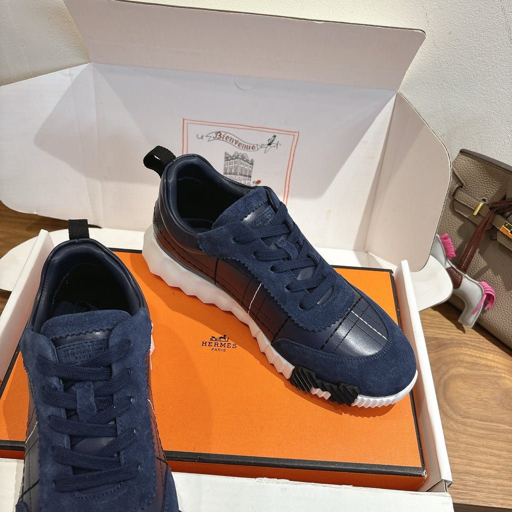 Unisex navy lace-up sneakers with silver toe panels and white cushioned sole
