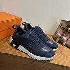 Unisex navy lace-up sneakers with textured panels, silver toe detail, white sole