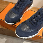 Unisex navy lace-up sneakers with silver grid toe panel and white sole