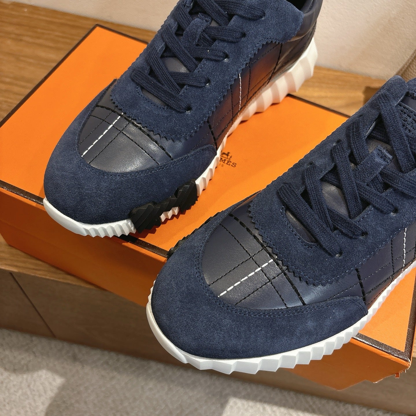 Unisex navy lace-up sneakers with silver grid toe panel and white sole