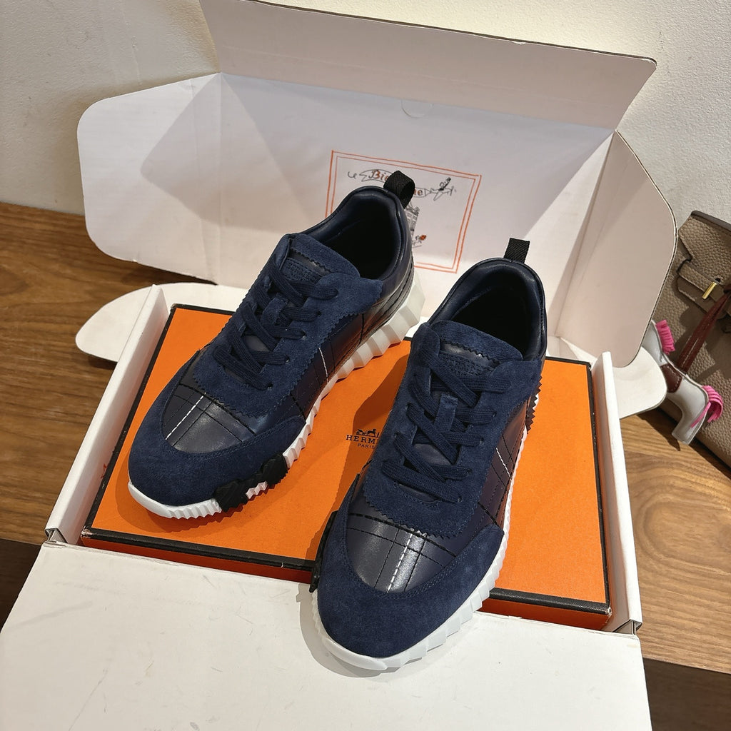 Unisex navy lace-up sneakers with suede uppers and silver toe panels