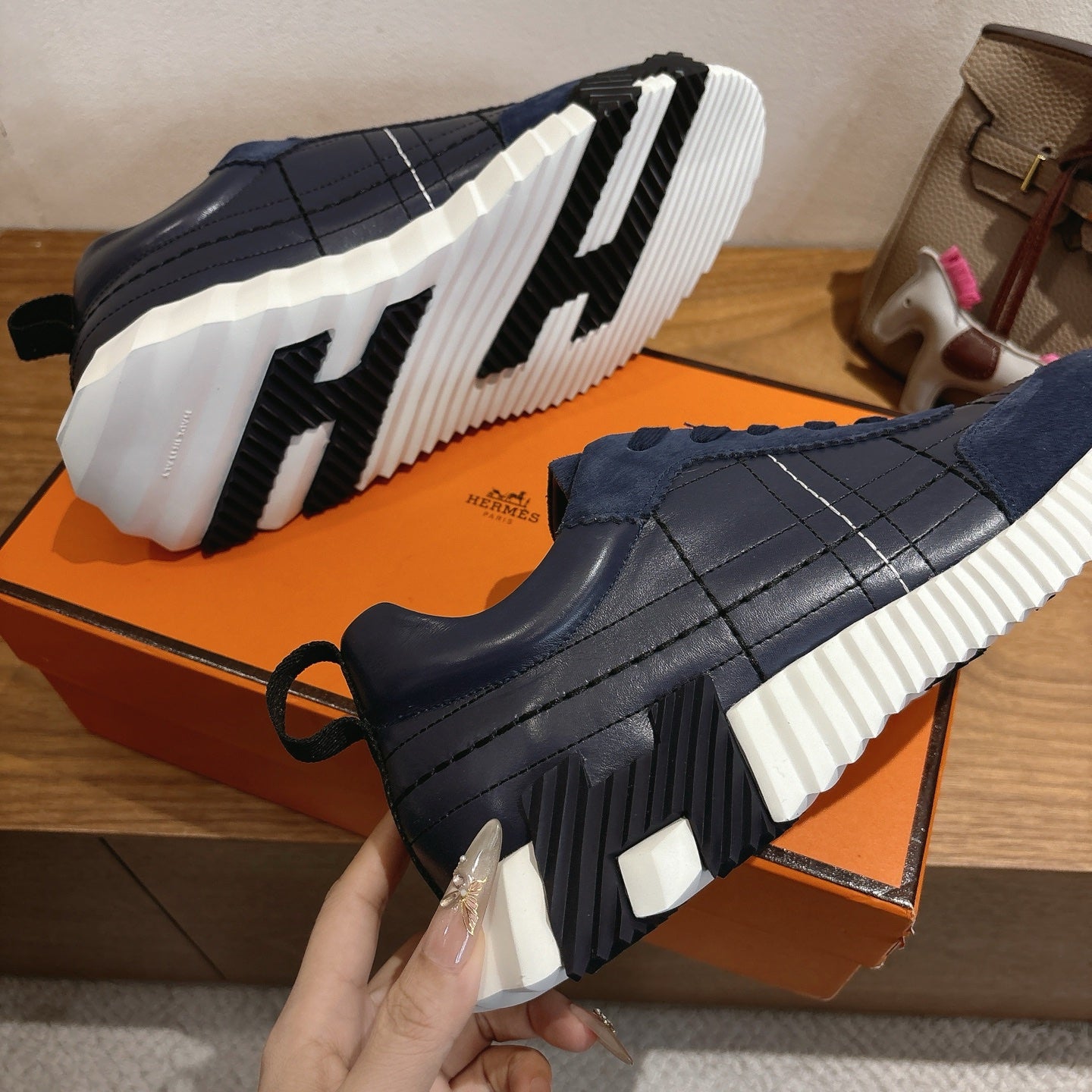 Unisex navy chunky sneakers with rear tread view and white ridged sole