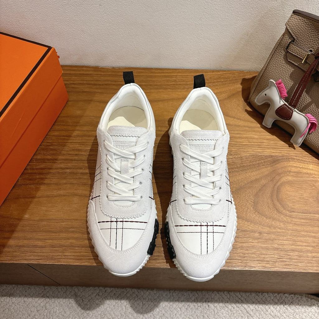 Hermes unisex white sneakers, lace-up, black grid stitching, chunky rubber sole.