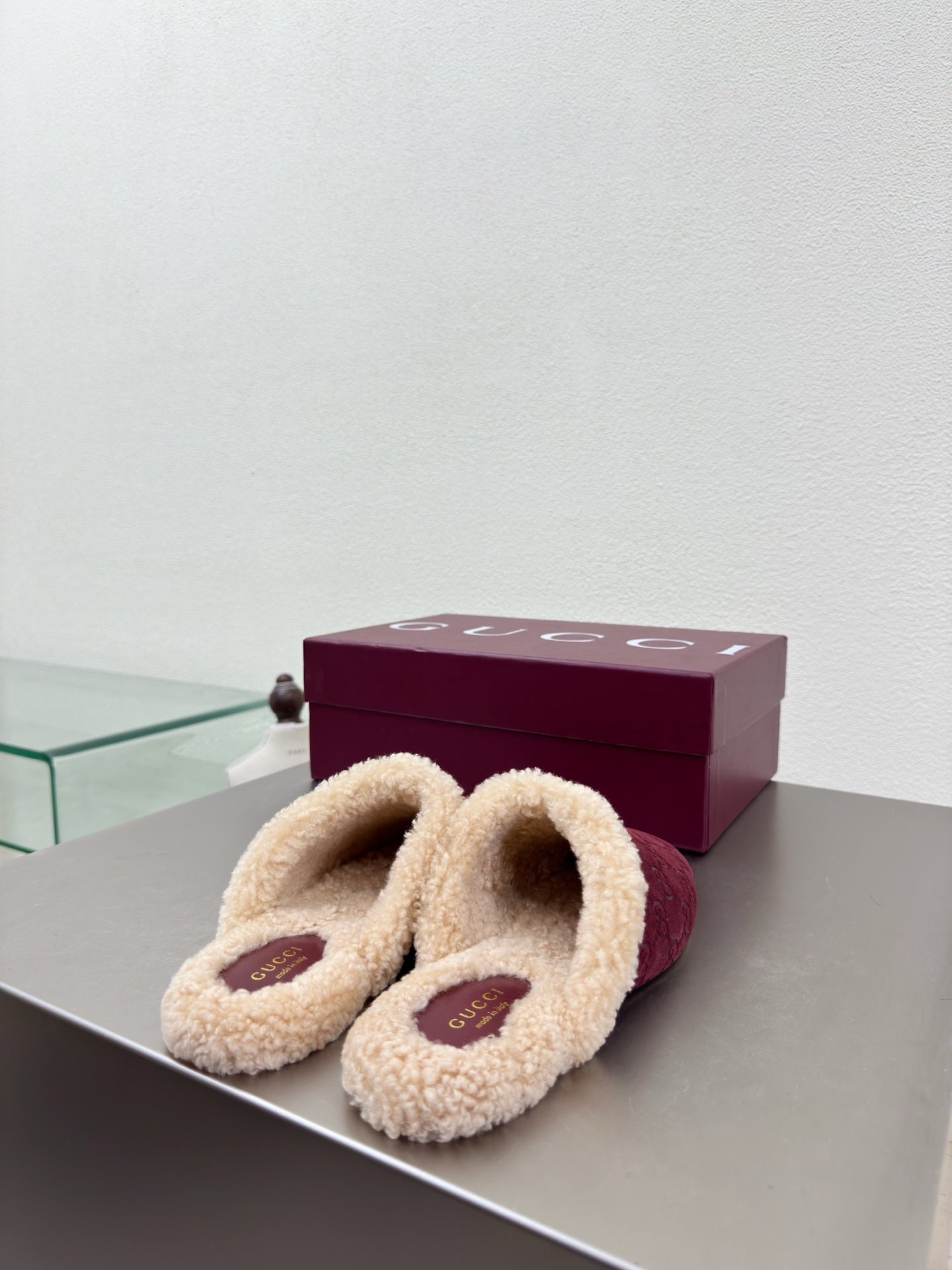 Gucci women's burgundy slip-on shoes with beige shearling collar and gold bit hardware
