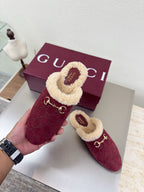 Gucci women's burgundy slip-on shoes with beige shearling trim and gold horsebit hardware