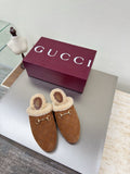 Brown suede shearling-lined mules with gold-tone horsebit buckle detail