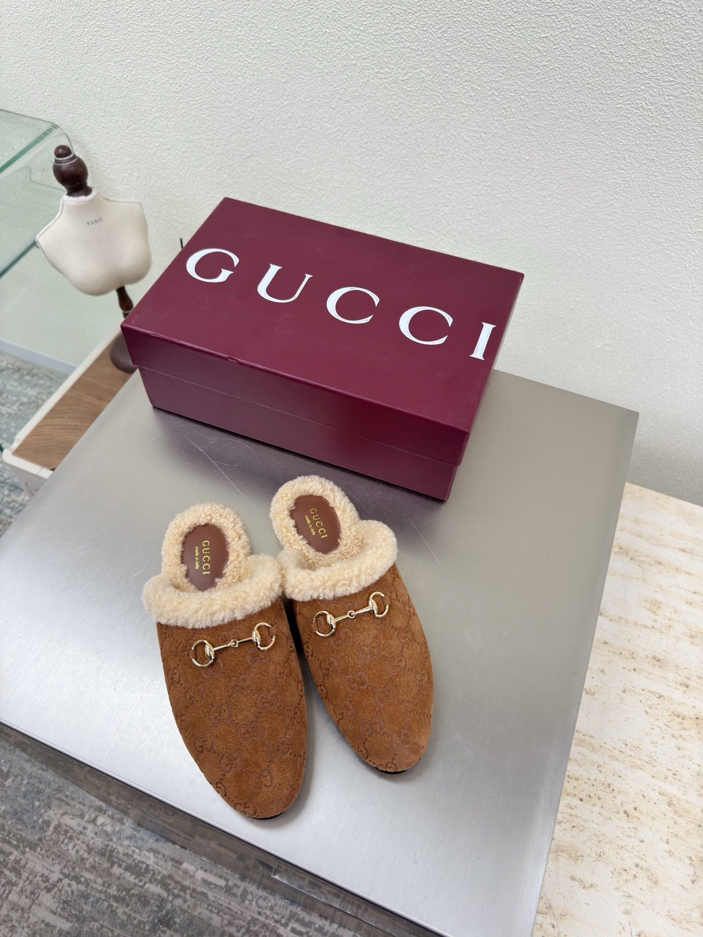 Brown suede shearling-lined mules with gold-tone horsebit buckle detail