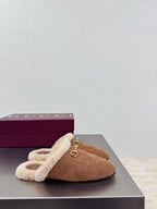 Brown suede mule with beige shearling collar and gold-tone horsebit detail