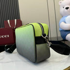 Gucci crossbody bag, lime green body with black shoulder strap and silver hardware.