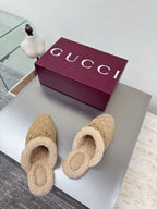 Beige GG monogram slip-on clogs with tan shearling lining and gold horsebit detail
