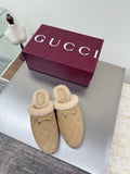 Beige GG monogram slip-on clog with tan shearling trim and gold horsebit detail