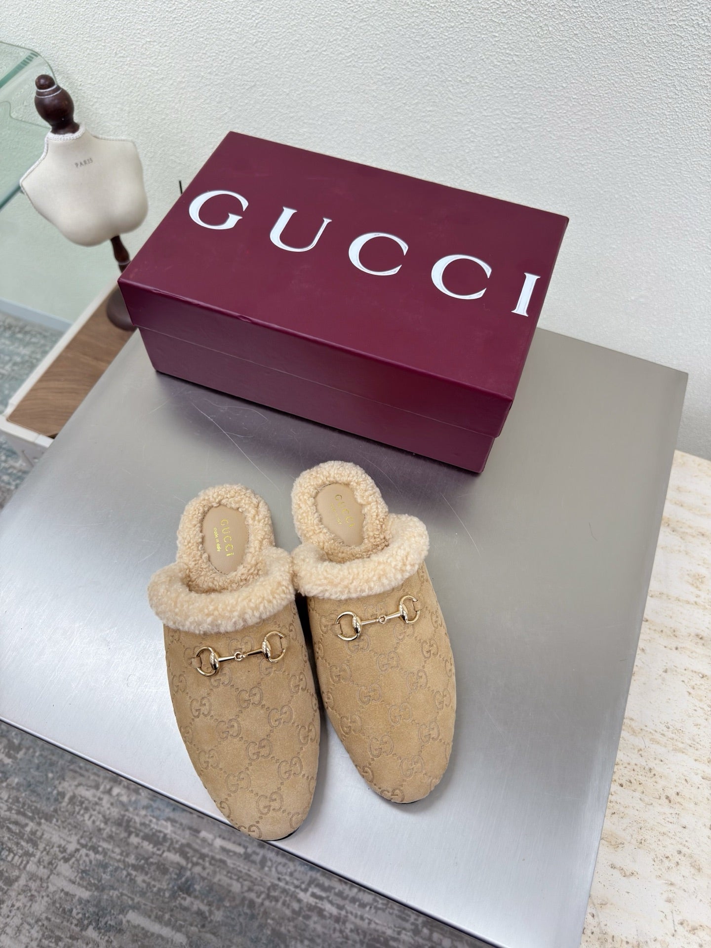 Beige GG monogram slip-on clog with tan shearling trim and gold horsebit detail