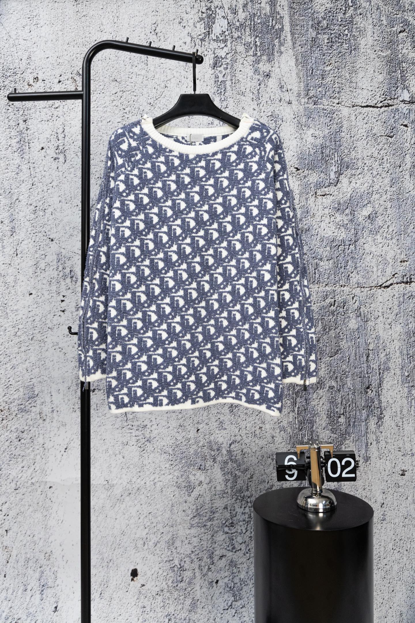 Blue knit sweater with Dior monogram pattern and ribbed crew neckline