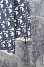 Blue Dior monogram knit sweater sleeve with ribbed cuff and zip-front seam