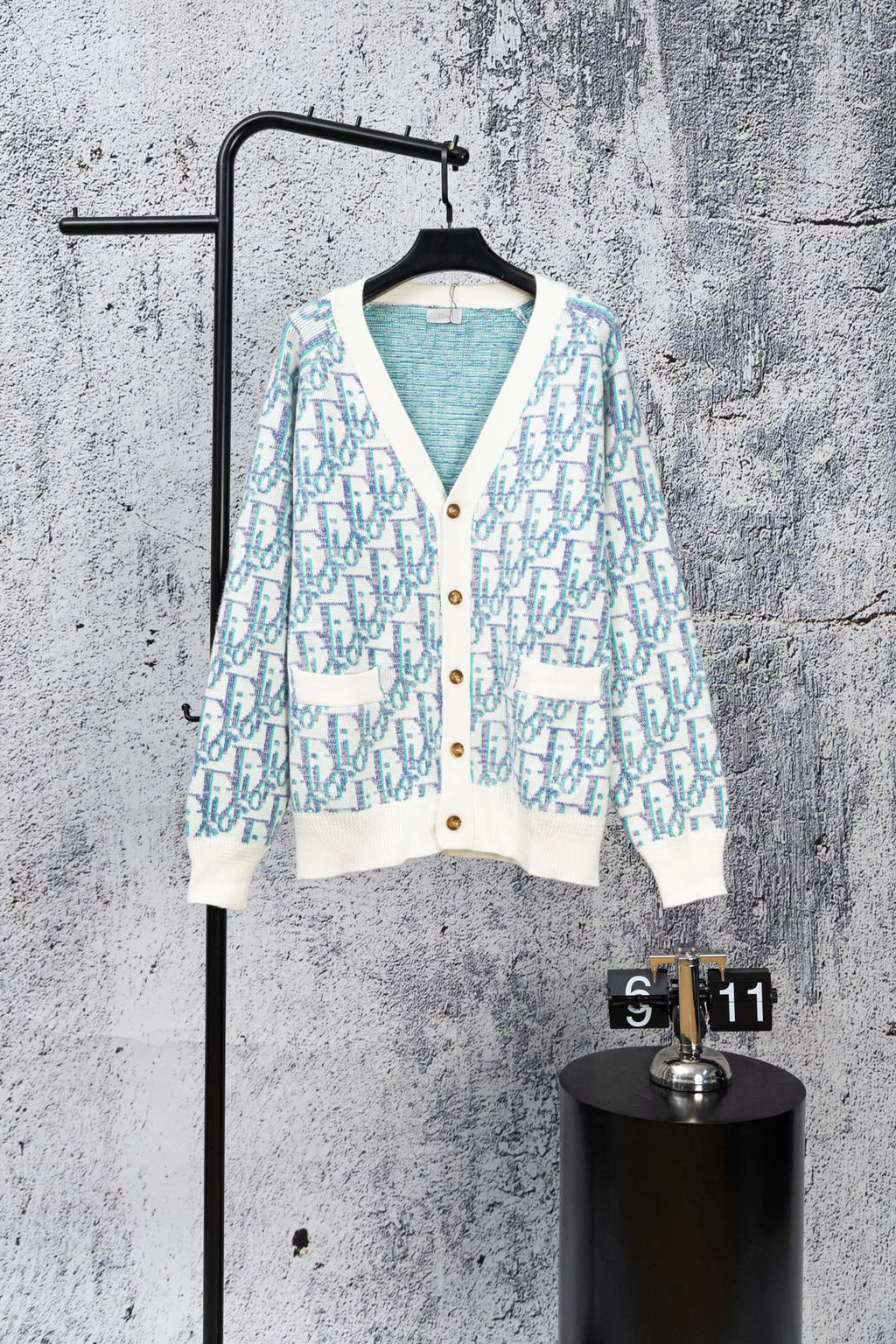 Long-sleeve knit cardigan with white button placket and blue patterned front