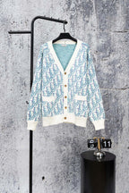 Long-sleeve knit cardigan with white button placket and blue patterned front