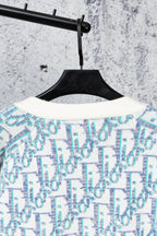 Knit cardigan with crew neckline and blue patterned yoke