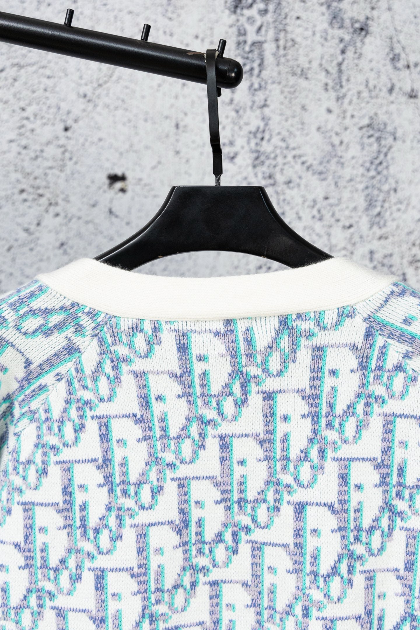 Knit cardigan with crew neckline and blue patterned yoke
