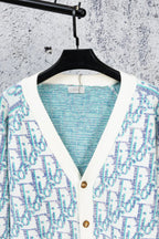 Backless view of V-neck knit cardigan with blue interior panel and button placket
