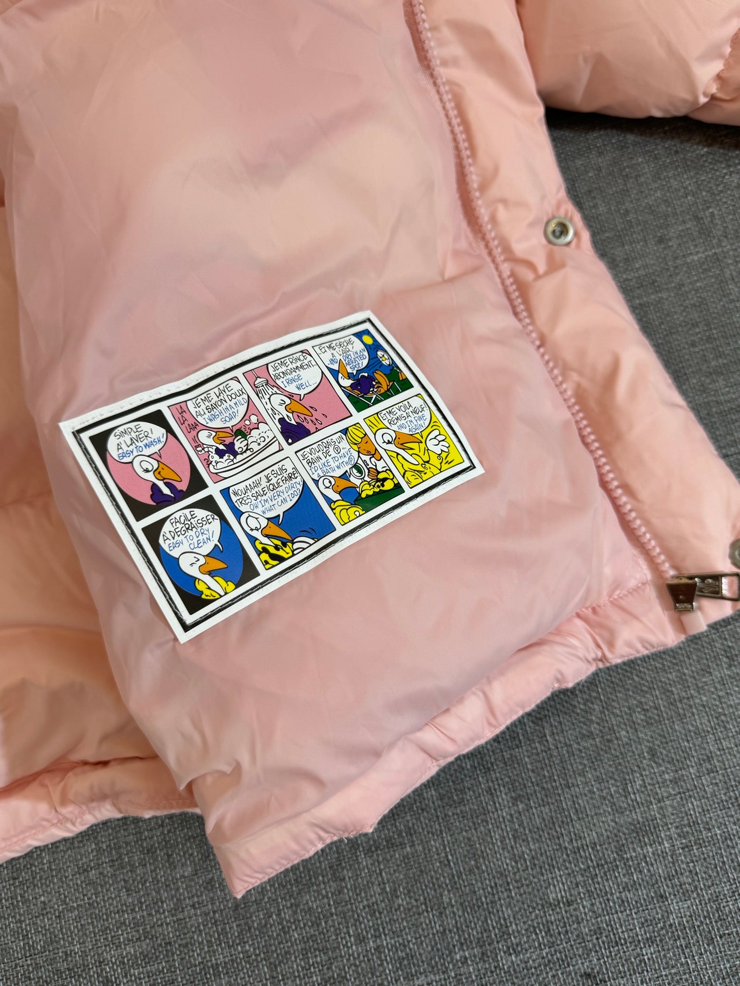 Moncler long puffer coat, pale pink with graphic chest patch and zipper