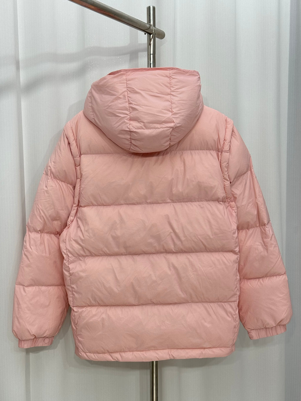 Moncler long puffer jacket, pink hooded back view with stitched quilt panels