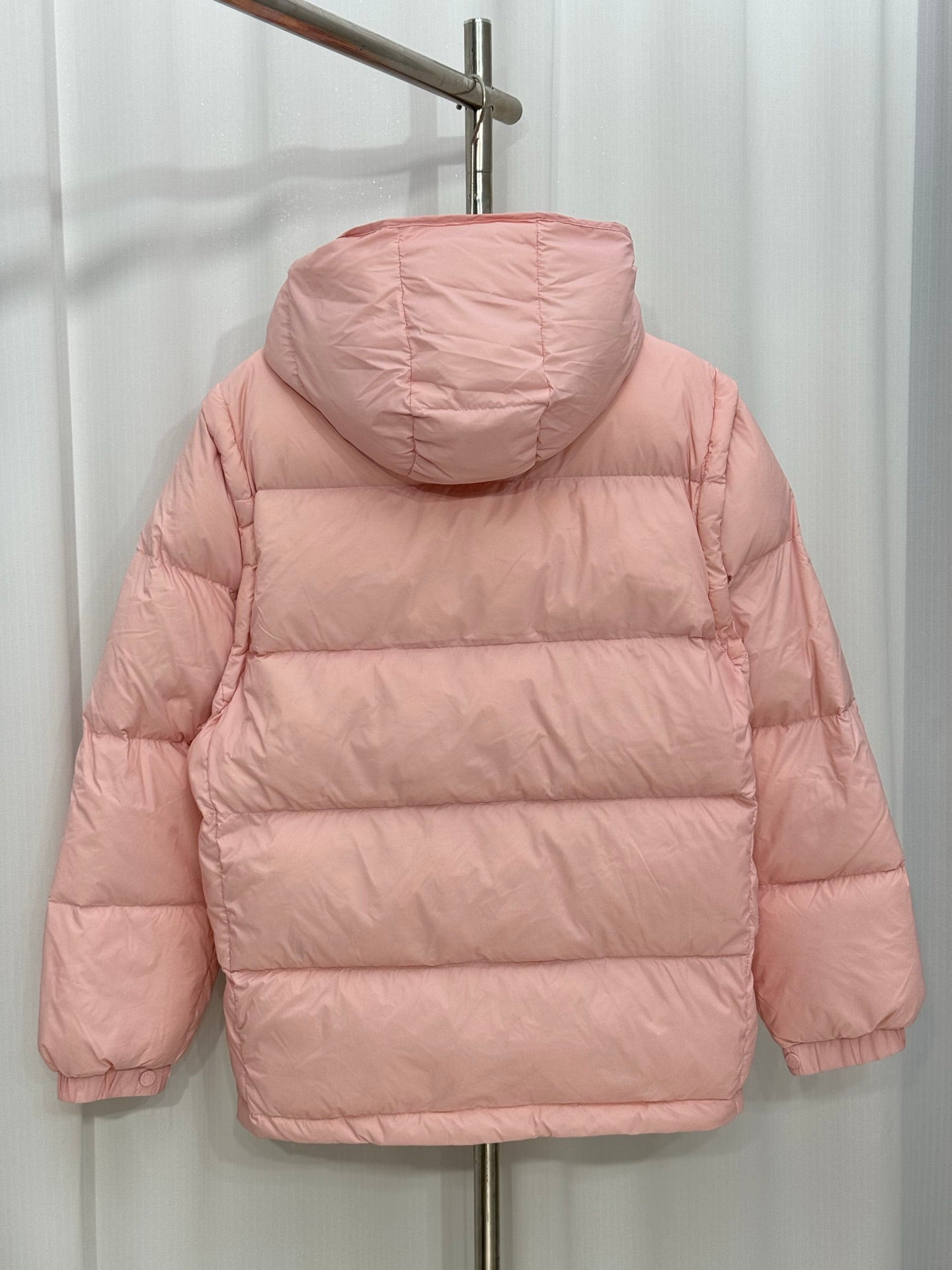 Moncler long puffer jacket, pink hooded back view with stitched quilt panels